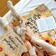 Folded sunflower portrait blanket showing rich golden yellow hues.