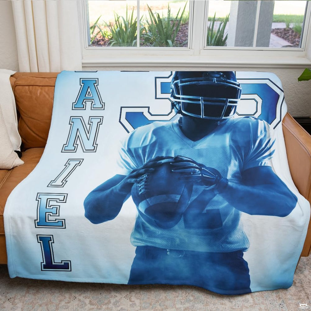 Navy and light blue sports bedding set accentuating themed bedroom decor.