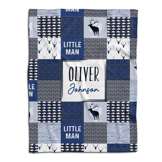 Woodland deer baby blanket displayed flat showing blue rustic patchwork squares highlighting stag and fish motifs