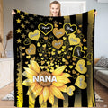 Person presenting the golden sunflower design with floating heart petals over flag stripes.
