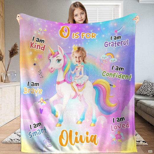 Pastel rainbow unicorn and fairytale princess blanket held upright