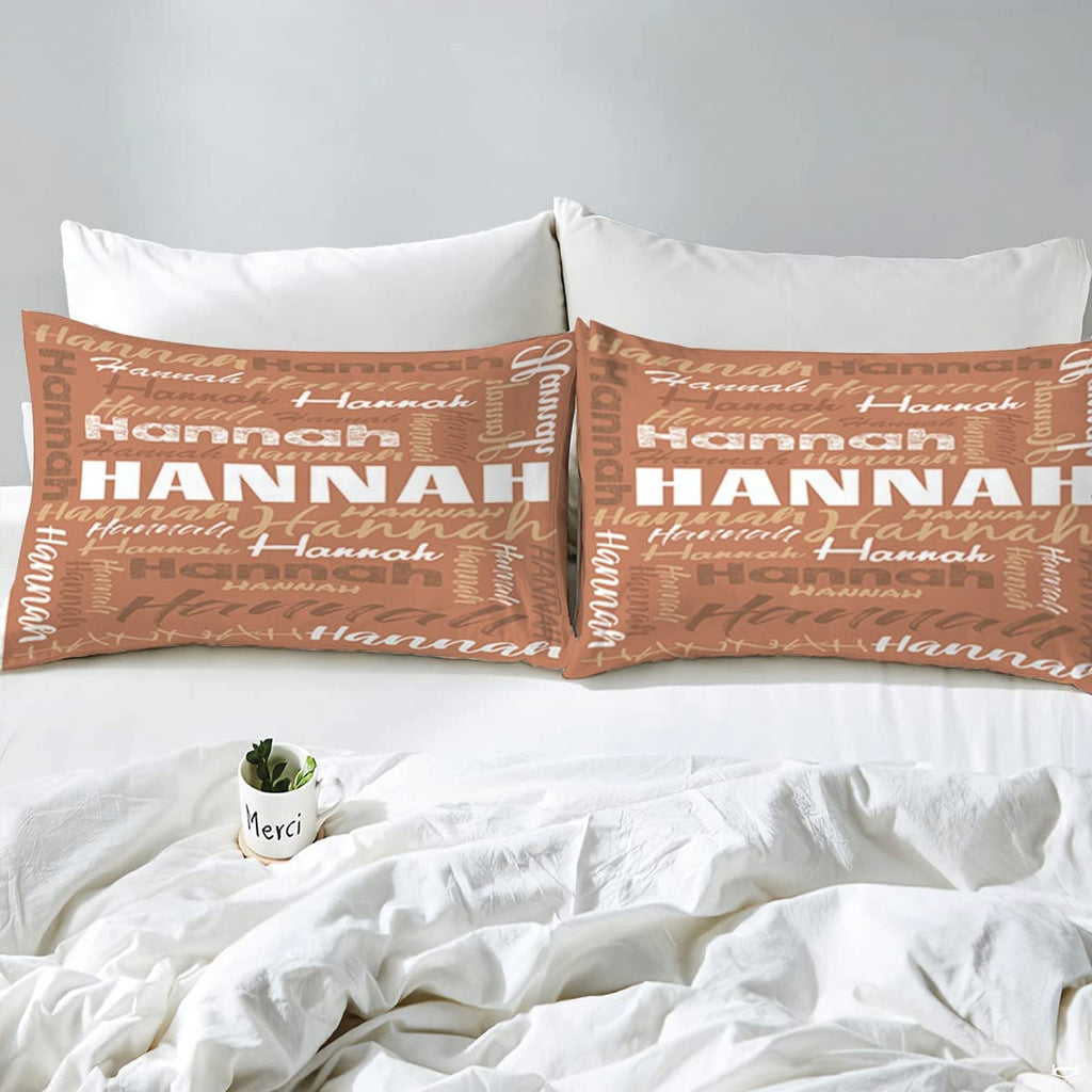 Overhead view of terracotta typography bedding spread across a contemporary bedroom bed