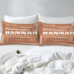 Overhead view of terracotta typography bedding spread across a contemporary bedroom bed