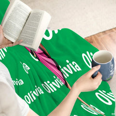 Detailed view of cheerleader high leg hold graphic in pink uniform against emerald background.