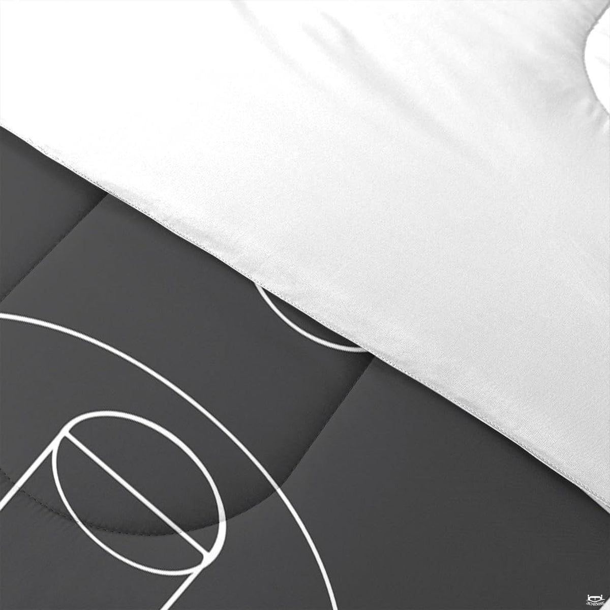 Side angle view of monochrome soccer bedding styled with athletic room accents and furniture
