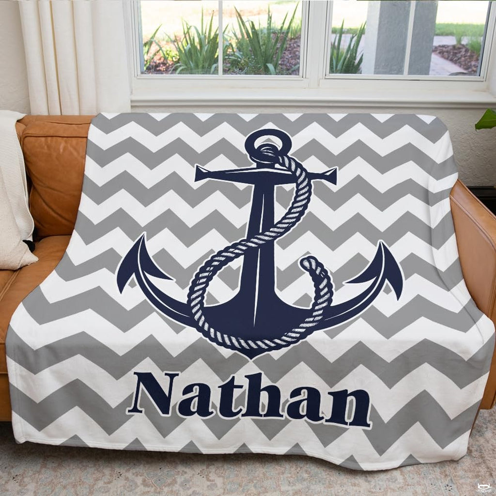 Overhead presentation displaying the complete nautical anchor bedding set composition and chevron line art.