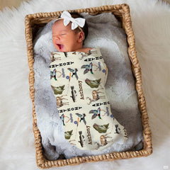 Whitetail deer illustration on neutral hunting themed bedding sets for rustic nursery decor.