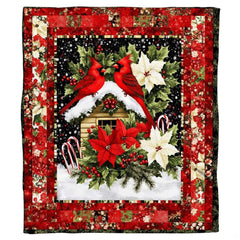 Bedding styled like popular red cardinal bed and breakfast photos in a holiday room.