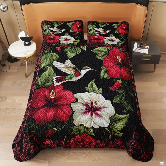 Overhead view of tropical hummingbird and hibiscus floral bedding design