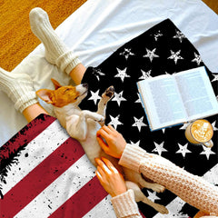 Rustic bigfoot american flag blanket draped across bedroom bed