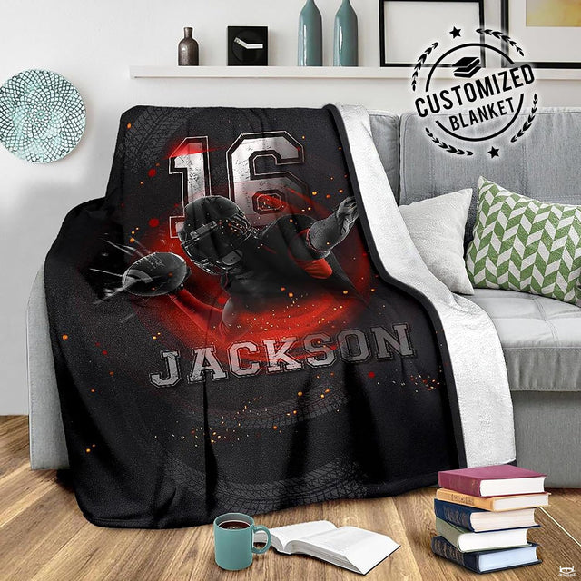 Close view of diving athlete in black helmet and glowing embers on blanket