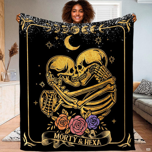 Gold skeleton lovers celestial throw blanket featuring embracing skeletons and moon phases on black