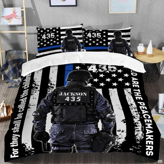 Patriotic law enforcement tribute bedding set displayed in modern bedroom setting with bold blue stripe motif.