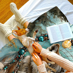 Overhead flat view displaying the turquoise beadwork and dreamcatcher feathers around wolves.