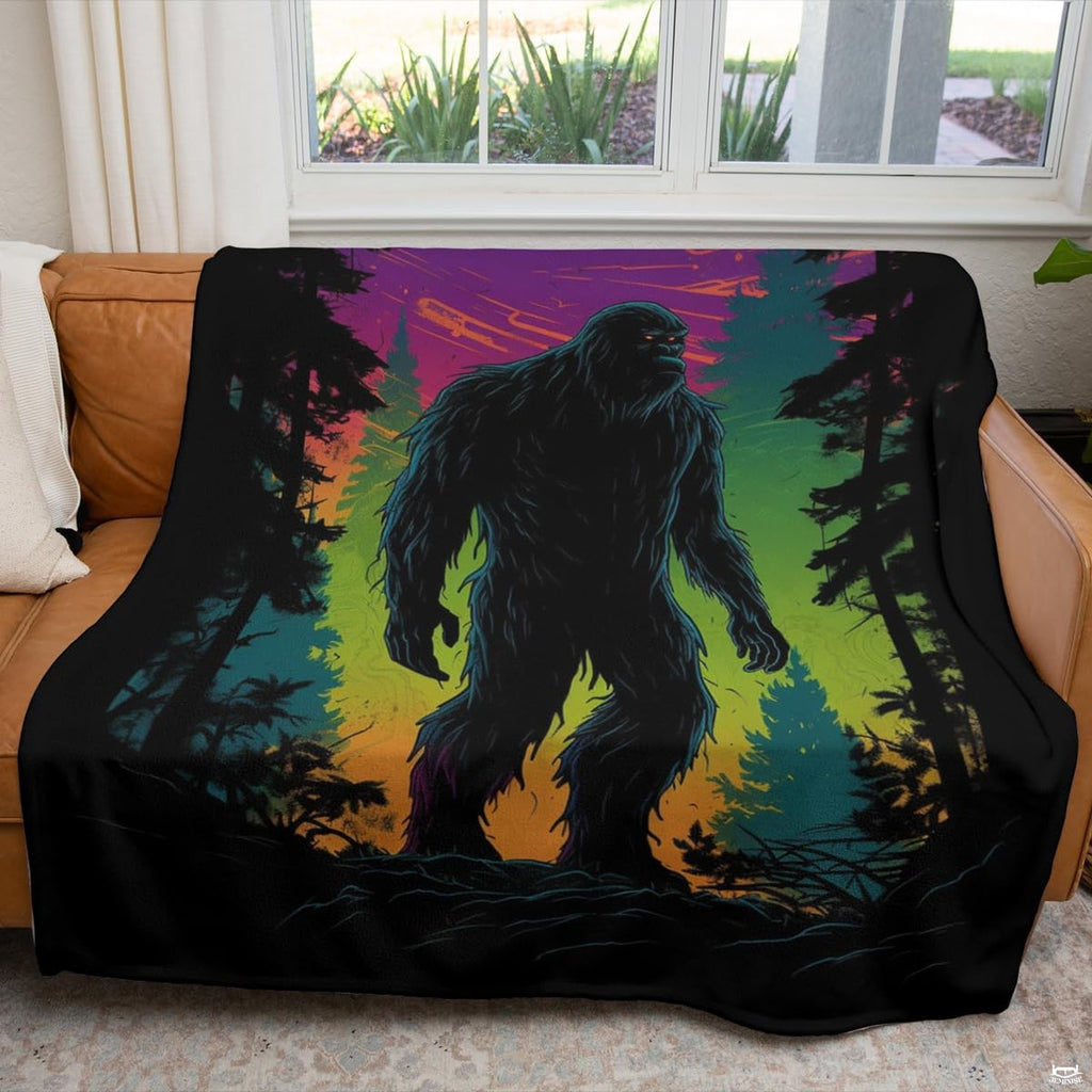 Neon Bigfoot and synthwave forest blanket draped across a living room couch near a window.