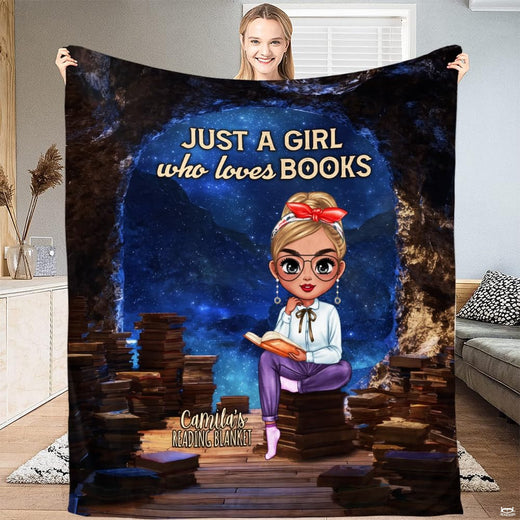 Person holding open the starry night throw blanket displaying the full celestial illustration.
