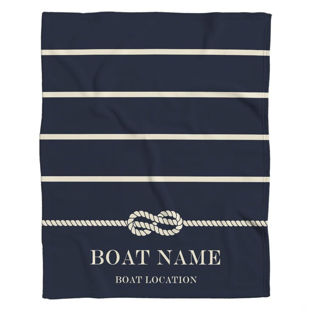 Navy coastal bedding showcasing ivory horizontal bands on a midnight ocean backdrop.