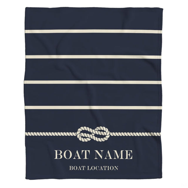 Navy coastal bedding showcasing ivory horizontal bands on a midnight ocean backdrop.