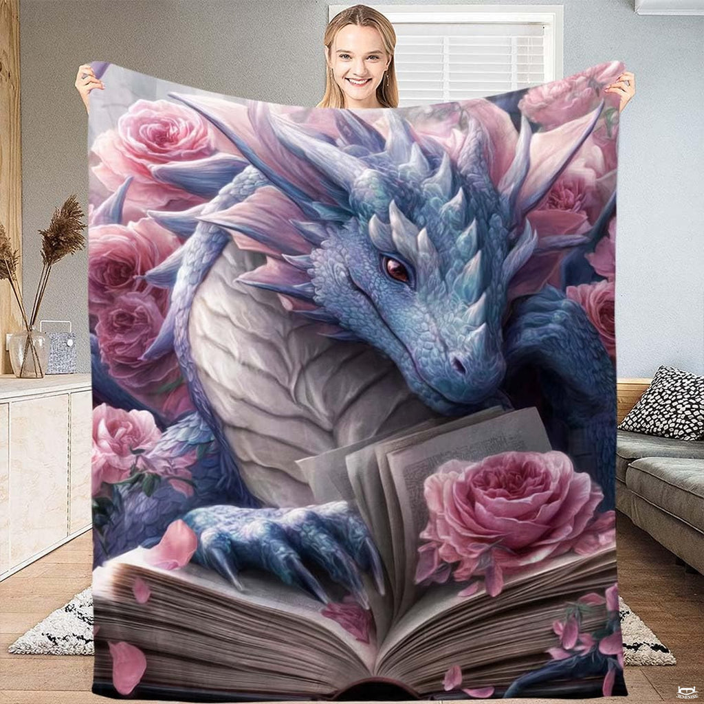 Pastel blue dragon with open storybook and pink roses displayed in a bright living space