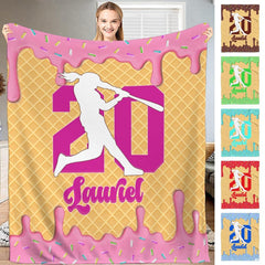 Lifestyle view of woman holding waffle cone softball throw blanket showcasing batter silhouette and numerals.