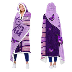 Close-up perspective of purple butterflies and bible verses on hooded blanket