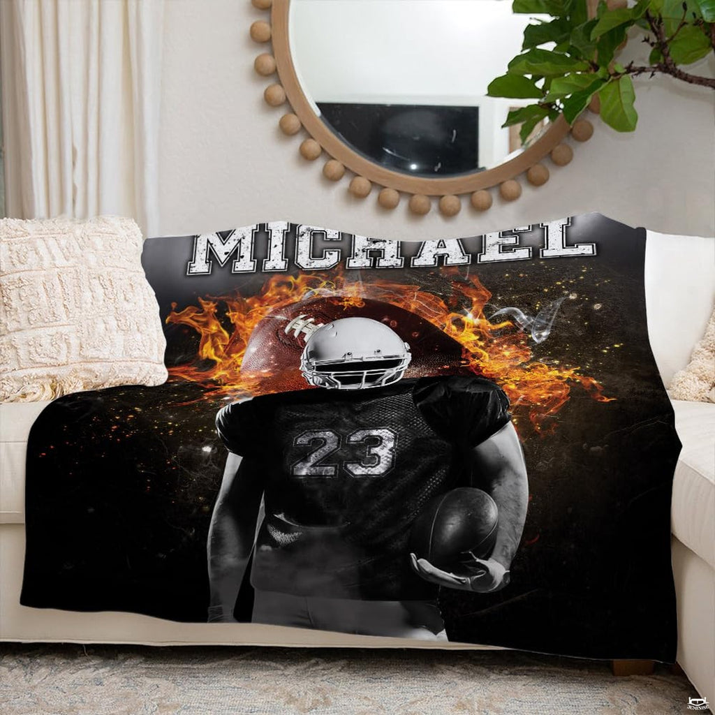 Detailed view of jersey numbering and glowing fire embers on football athlete throw blanket