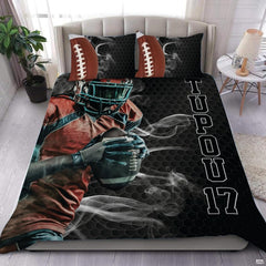 Dark charcoal football sports bedding featuring textured football graphic and yard lines on a bed