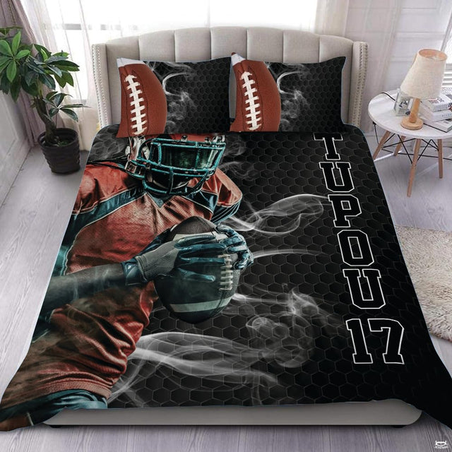 Dark charcoal football sports bedding featuring textured football graphic and yard lines on a bed
