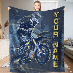 Motocross dirt bike action throw blanket held open by woman