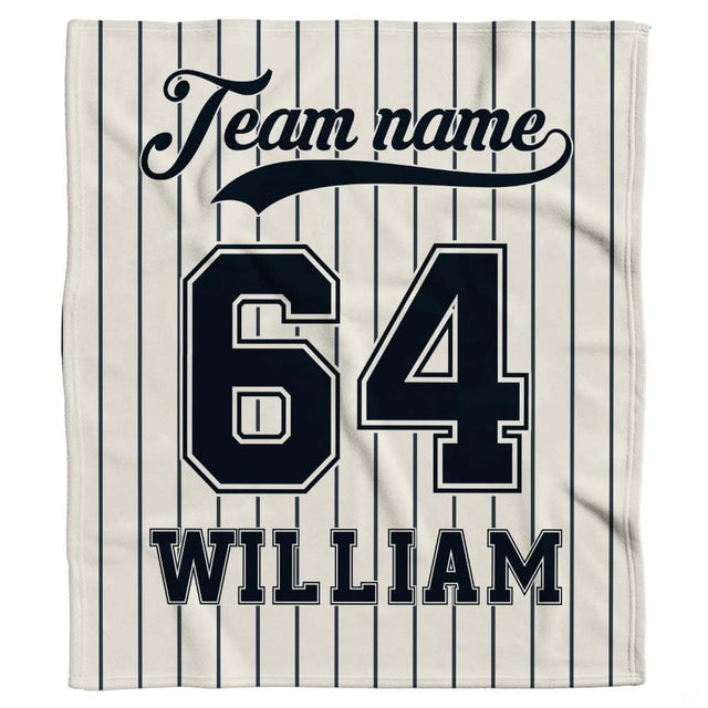 Classic baseball jersey aesthetic with navy pinstripes and bold athletic block numbers displayed on bed.