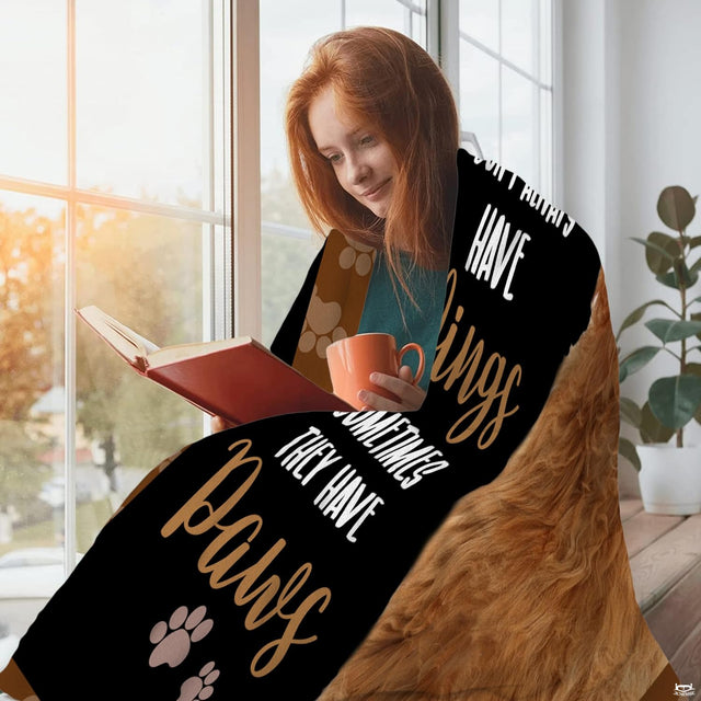 Canine golden doodle throw blanket styled across a living room sectional sofa