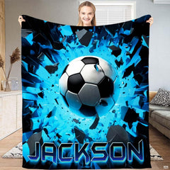 Dynamic 3D soccer ball bursting through electric blue shattered fragments against neon cyan decor.