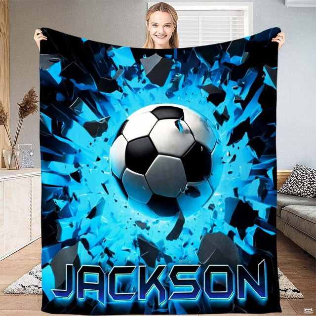 Dynamic 3D soccer ball bursting through electric blue shattered fragments against neon cyan decor.