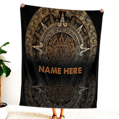 Carved Aztec bedding set displaying golden bronze sun stone medallion engravings over dark obsidian relief.