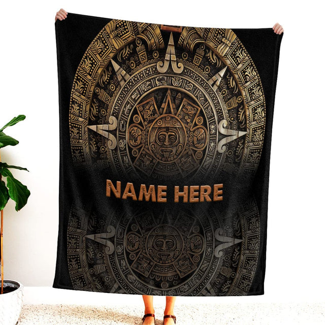 Carved Aztec bedding set displaying golden bronze sun stone medallion engravings over dark obsidian relief.