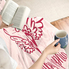 Overhead presentation of blush pink angel remembrance blanket