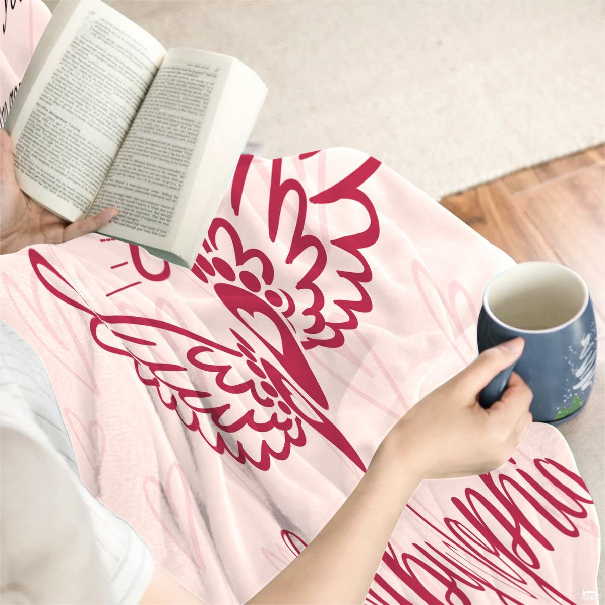 Overhead presentation of blush pink angel remembrance blanket