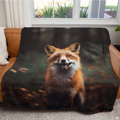 Close-up perspective of smiling red fox face with alert pointed ears on wildlife throw blanket