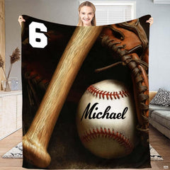 Wooden baseball bat, baseball with red lacing, and vintage fielder mitt in dramatic studio shadows, view 2.