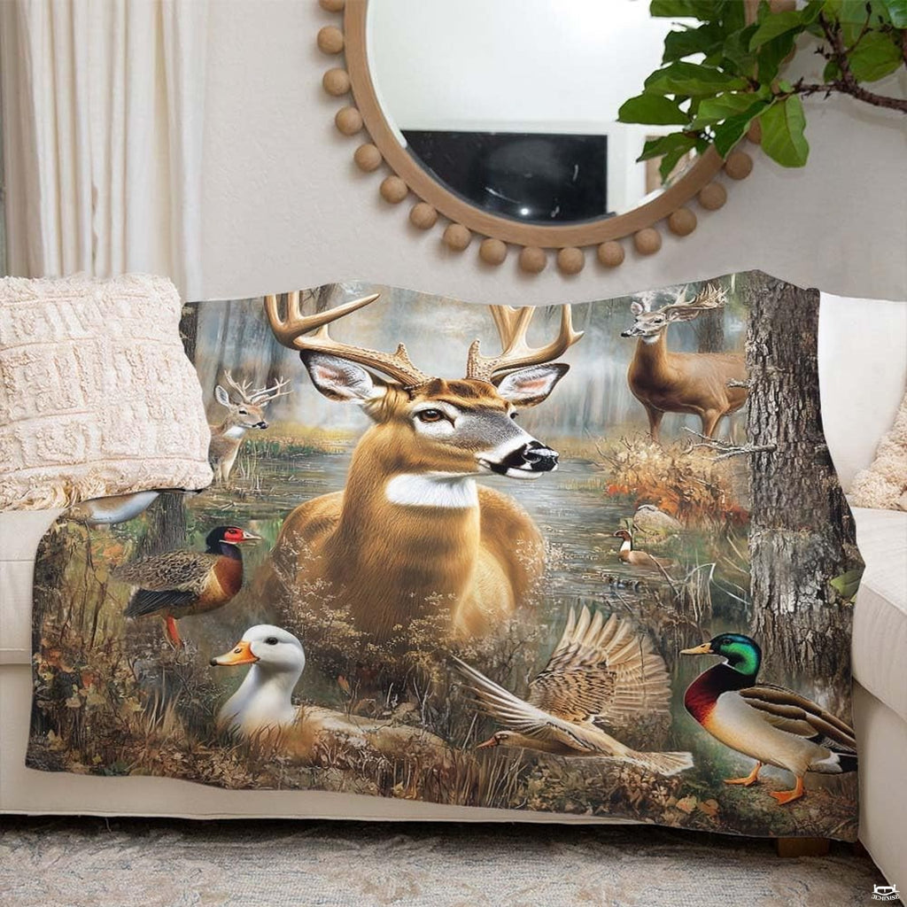 Rustic forest wildlife blanket styled on a living room couch under a circular mirror