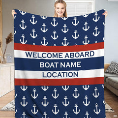 Nautical anchor bedding set featuring crisp white anchors on navy blue with bold red maritime stripes.