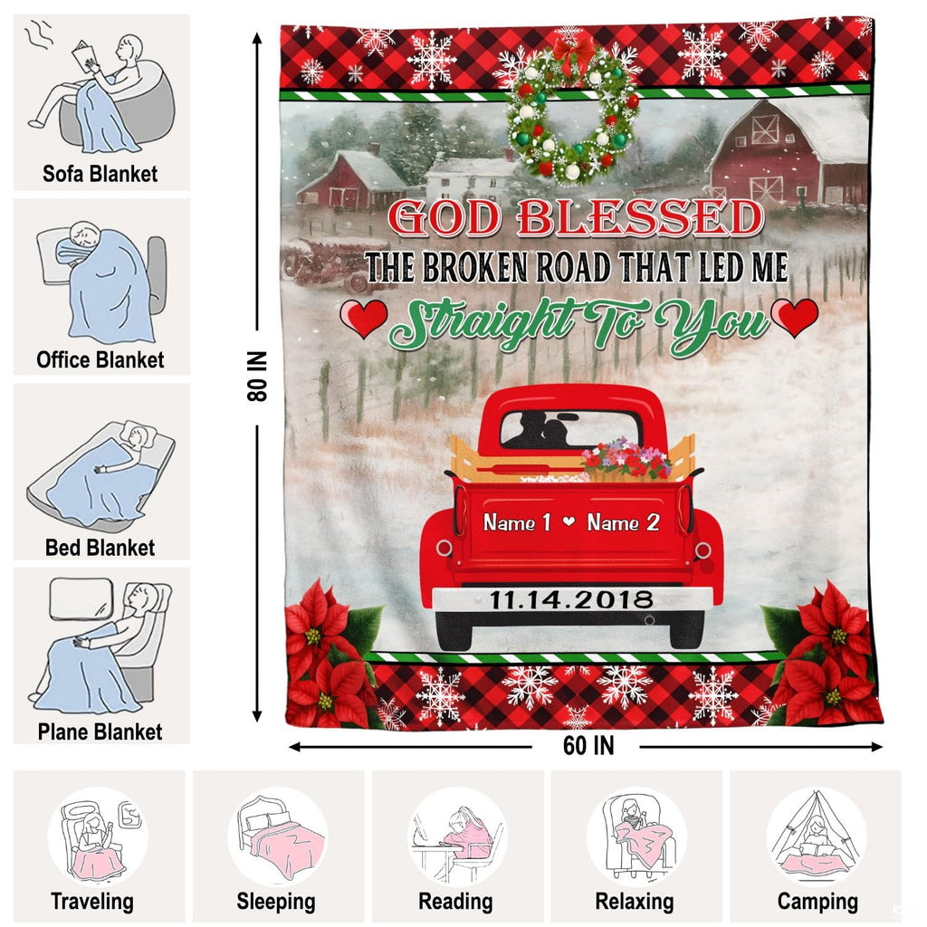 Close-up of decorative holiday wreath and vibrant poinsettia accents on Christmas red truck artwork.