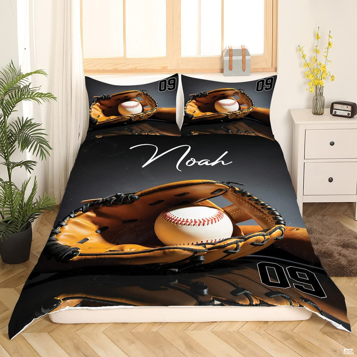 Marigold orange and charcoal baseball athletic sports bedding set displayed on a bed in a modern room