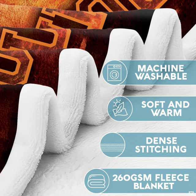 Close-up perspective of firefighter silhouette and utility axe illustration on Blanket.