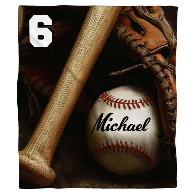 Wooden baseball bat, baseball with red lacing, and vintage fielder mitt in dramatic studio shadows, view 1.