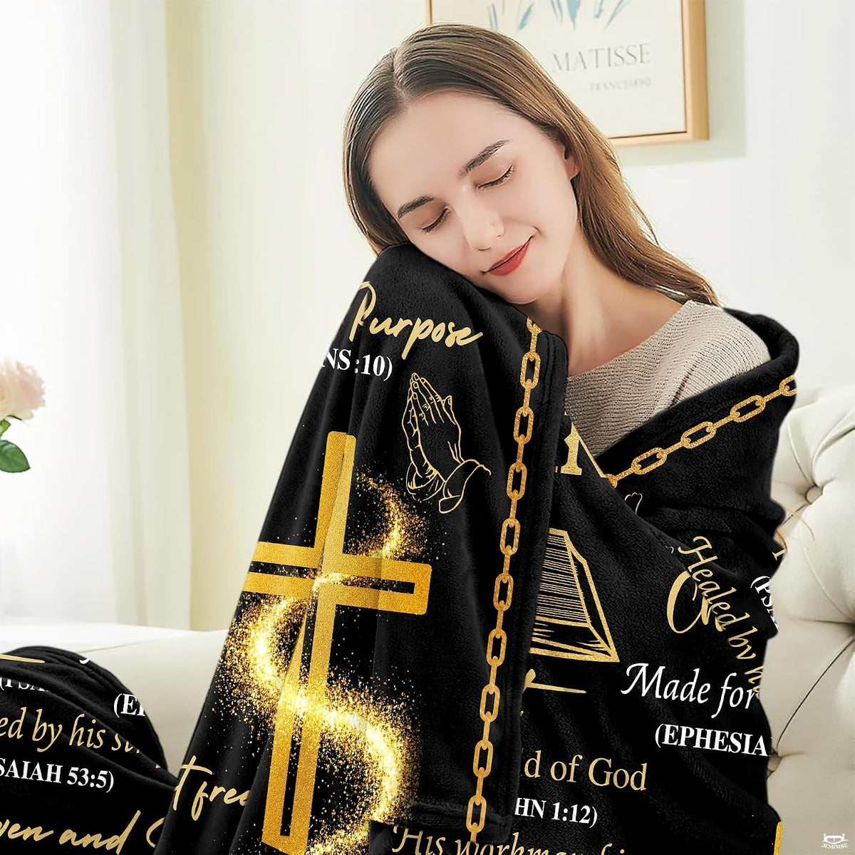 Living room sofa setting showcasing Christian cross devotional throw blanket.