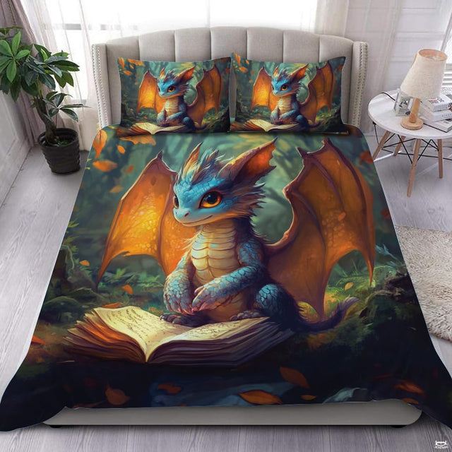 Blue dragon reading a glowing book on bedding