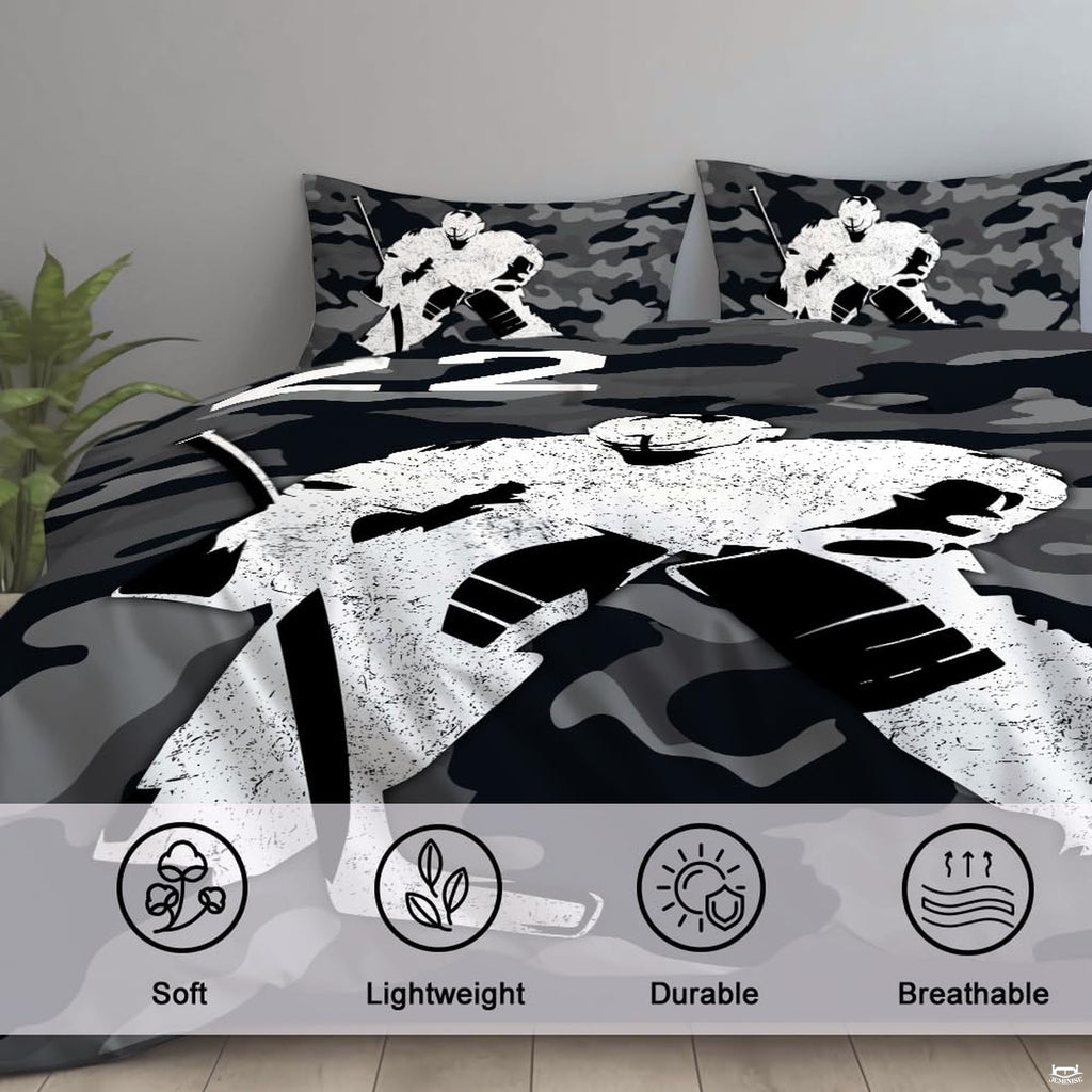 Folded corner view showing jet black and charcoal grey camouflage pattern on athletic bedding