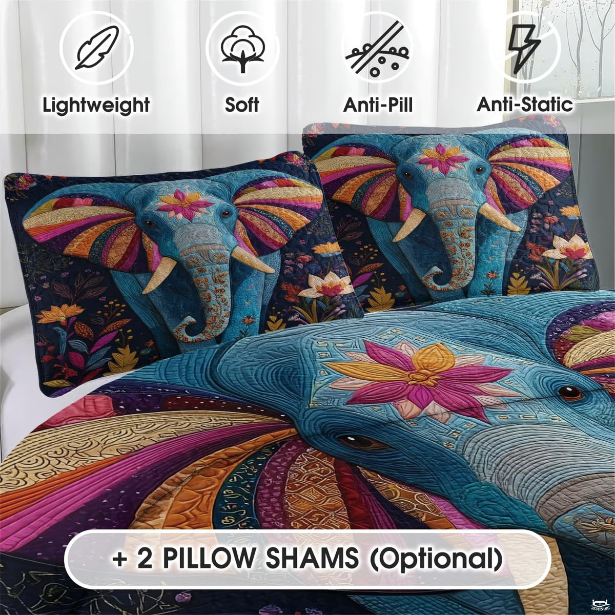 Close-up detail of elephant bedding displaying intricate mandala filigree patterns and deep burgundy plum print accents.