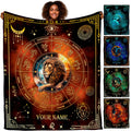 Model holding up a celestial blanket displaying a lion portrait within a golden astrological zodiac wheel.